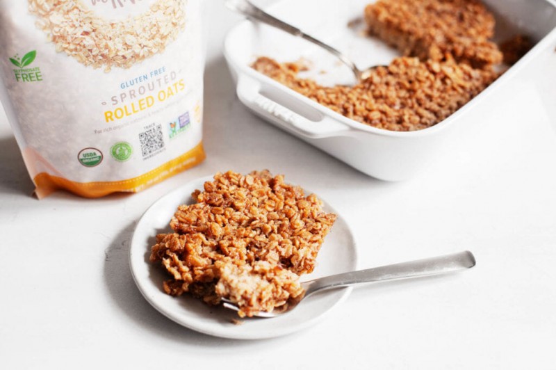 A breakfast scene, with a baking dish of whole grains and a small serving plate that's ready to eat.