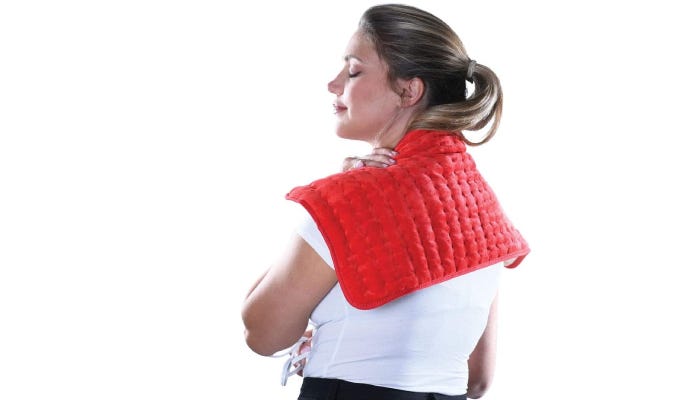 woman with a red heating pad resting on her neck and shoulders