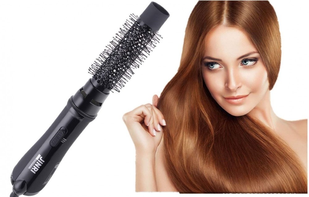 The JINRI Hair Dryer Brush and a woman with long red hair. 