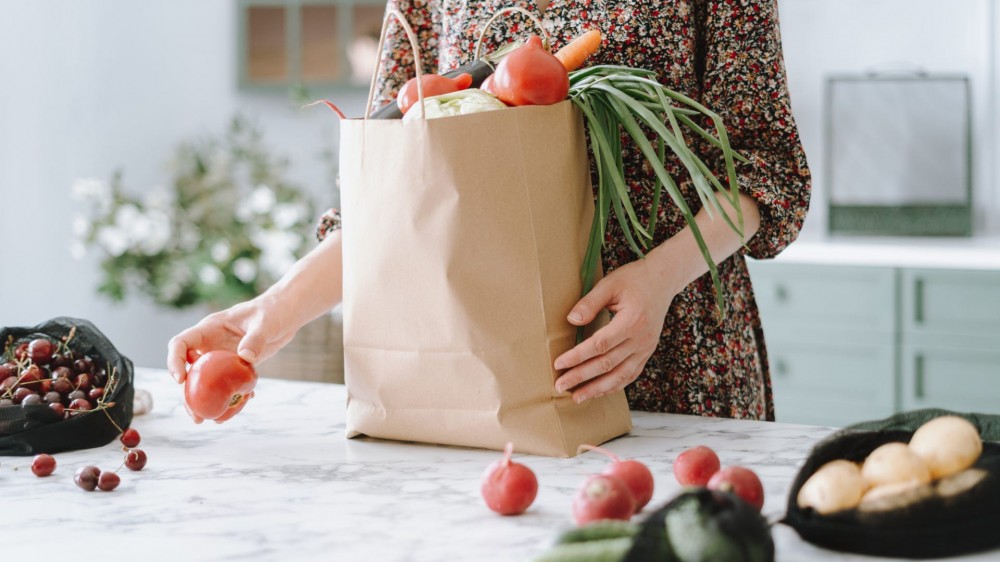 a woman unpacks groceries